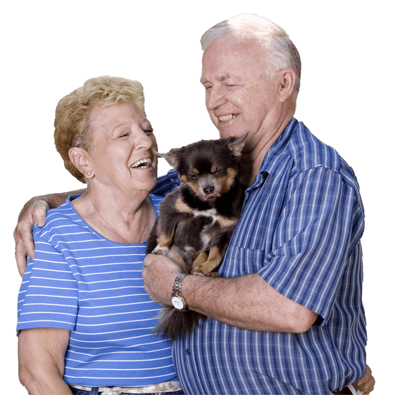 Happy senior couple hugging with puppy
